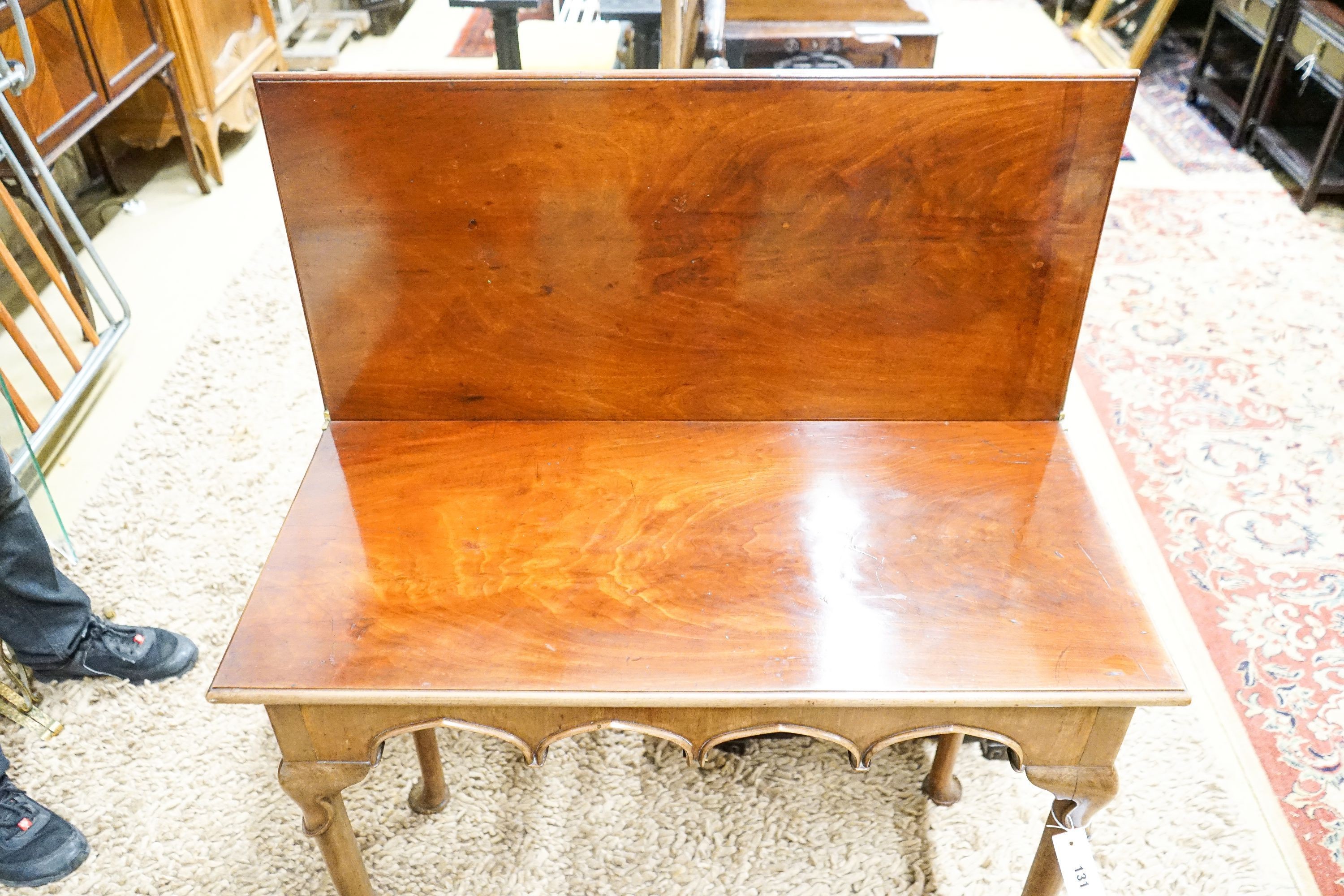 A George II rectangular mahogany folding tea table, width 86cm, depth 40cm, height 73cm